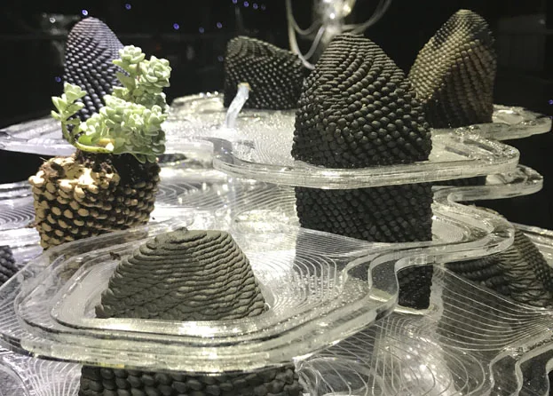 Printed stones on laser‑cut contour plates, with test plantings